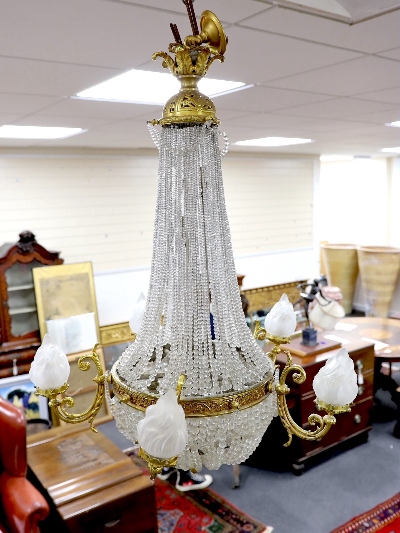 A cut and beaded glass and ormolu bag chandelier, approx 96cms high, approx 75cm diameter